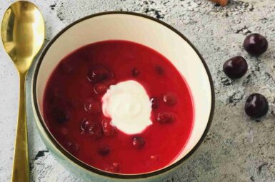 Fresh cold Sour Cherry Soup with whipped cream