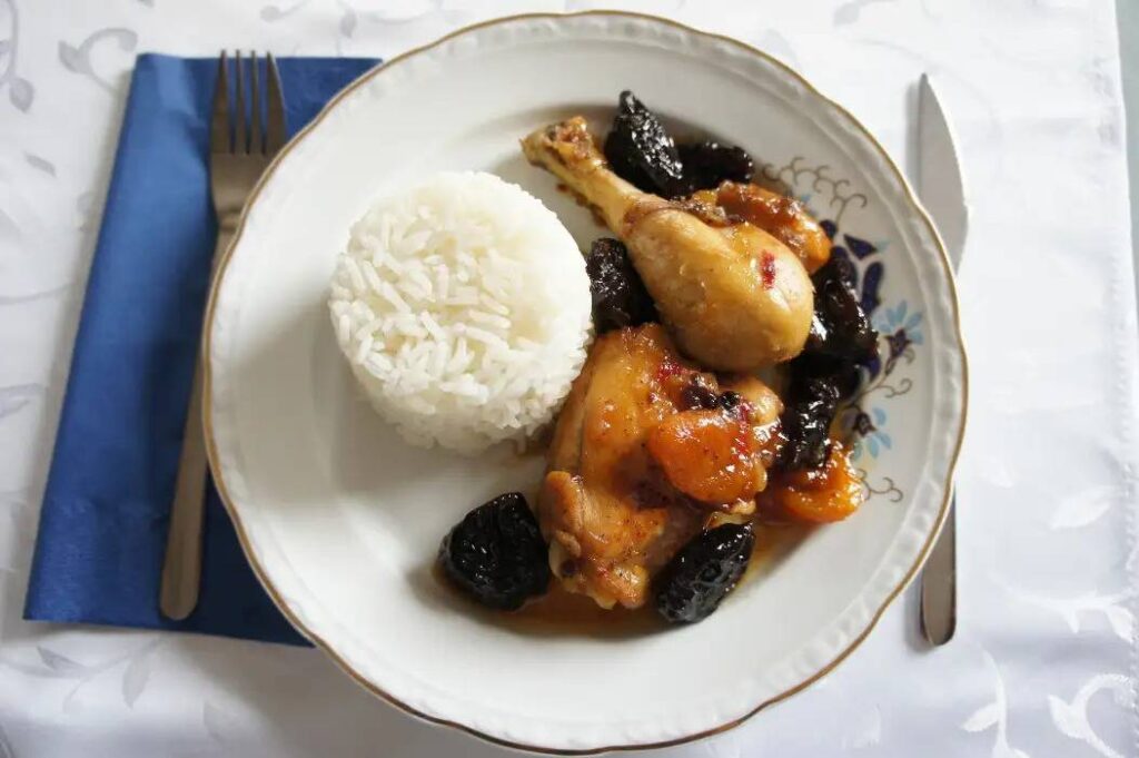 Honey Chicken with Dried Plum Apricot and Boiled Rice on a nice plate