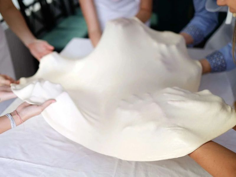 Stretching the dough with a small group