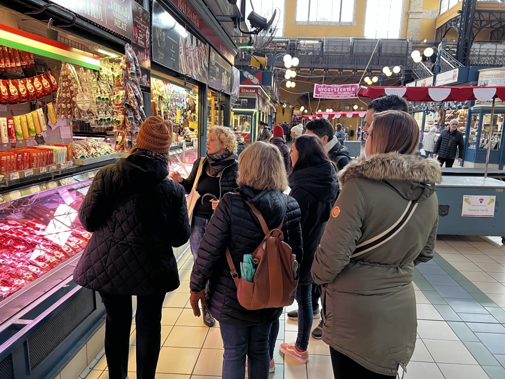 Guests exploring a local market before their Hungarian cooking class